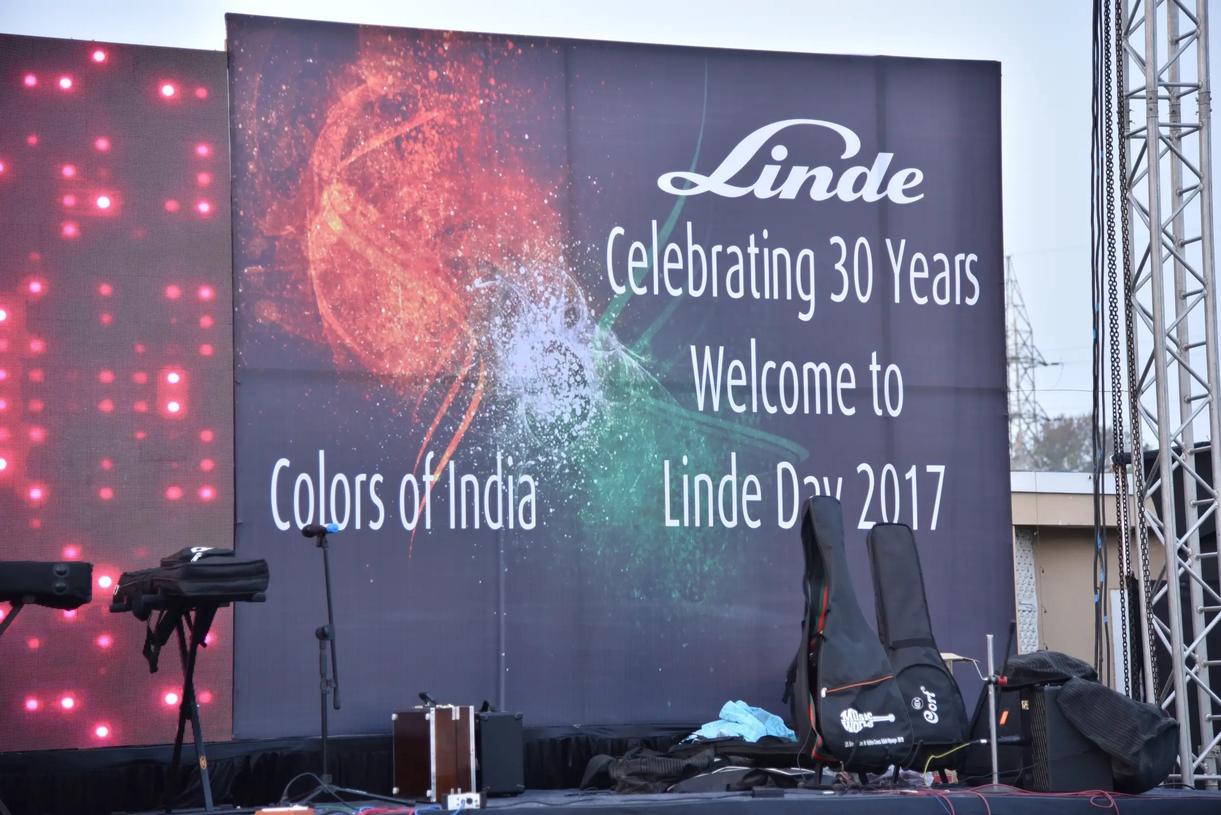 ITT event entrance with red and green carpet and pink lighting on white structure with ITT branding